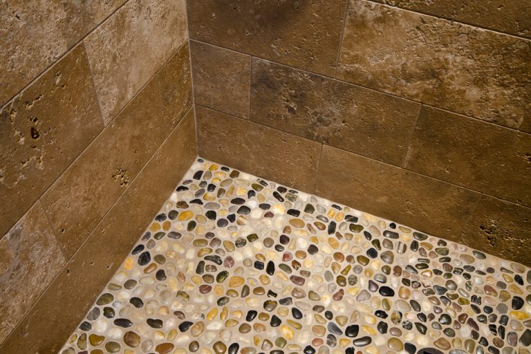 This close up is of a pebble floor in a shower - How To Remove A Pebble Shower Floor
