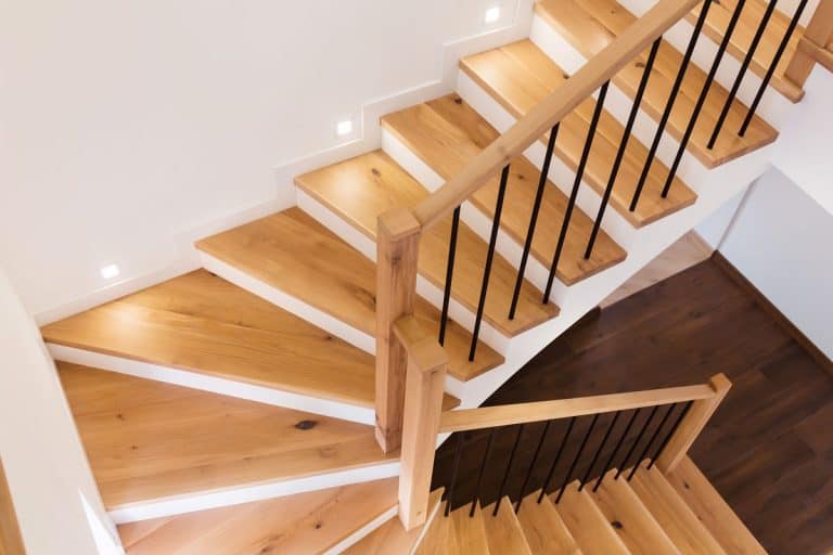 Wood staircase inside contemporary white modern house, How Much Space Does A Staircase Take?