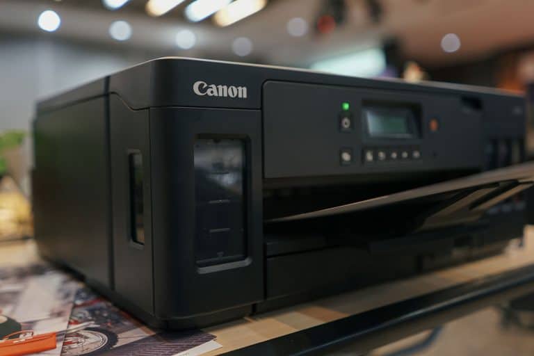 Canon printer placed on the office table, How To Find The Model Number On A Canon Printer