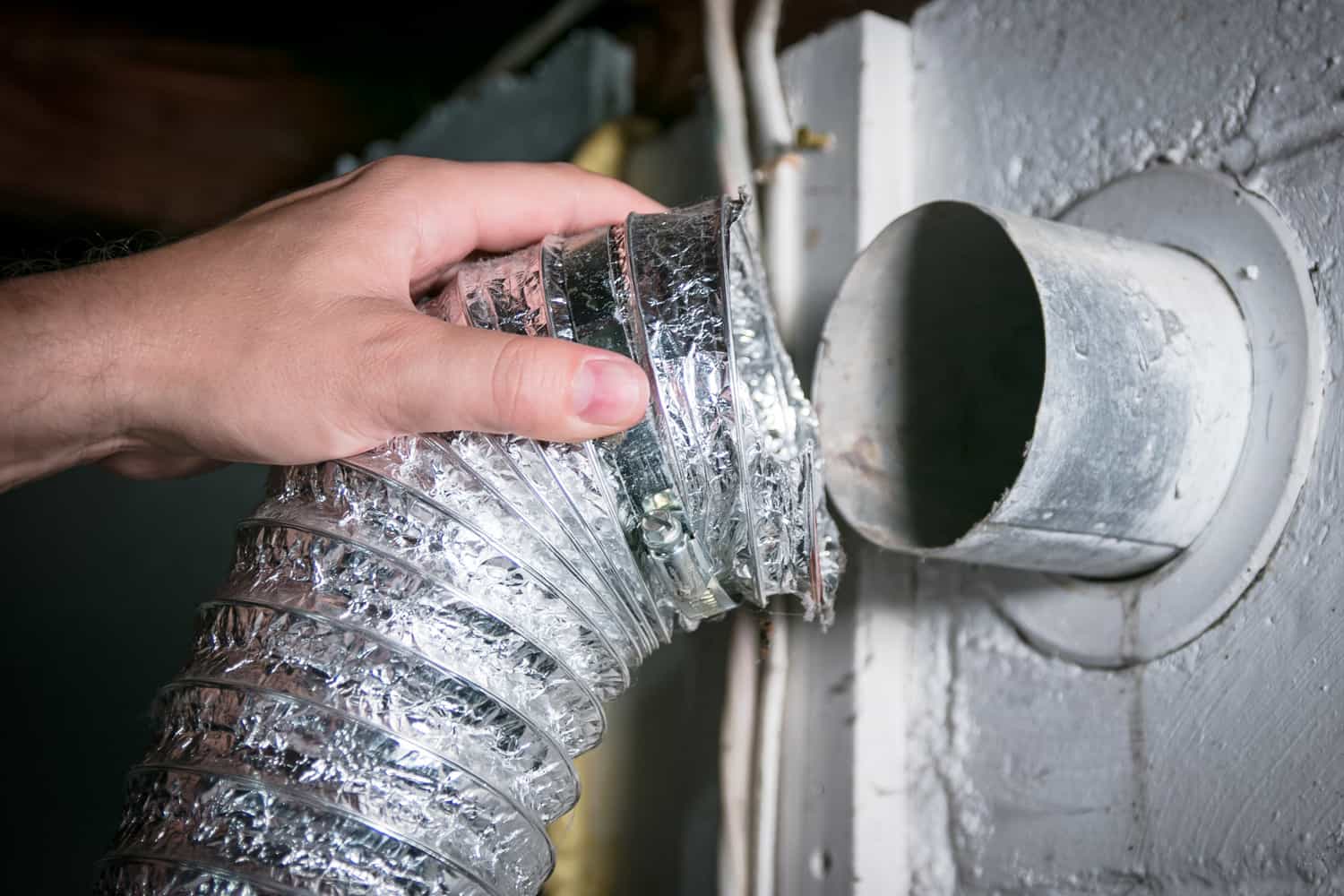 Flexible aluminum dryer vent hose, removed for cleaning repair maintenance.