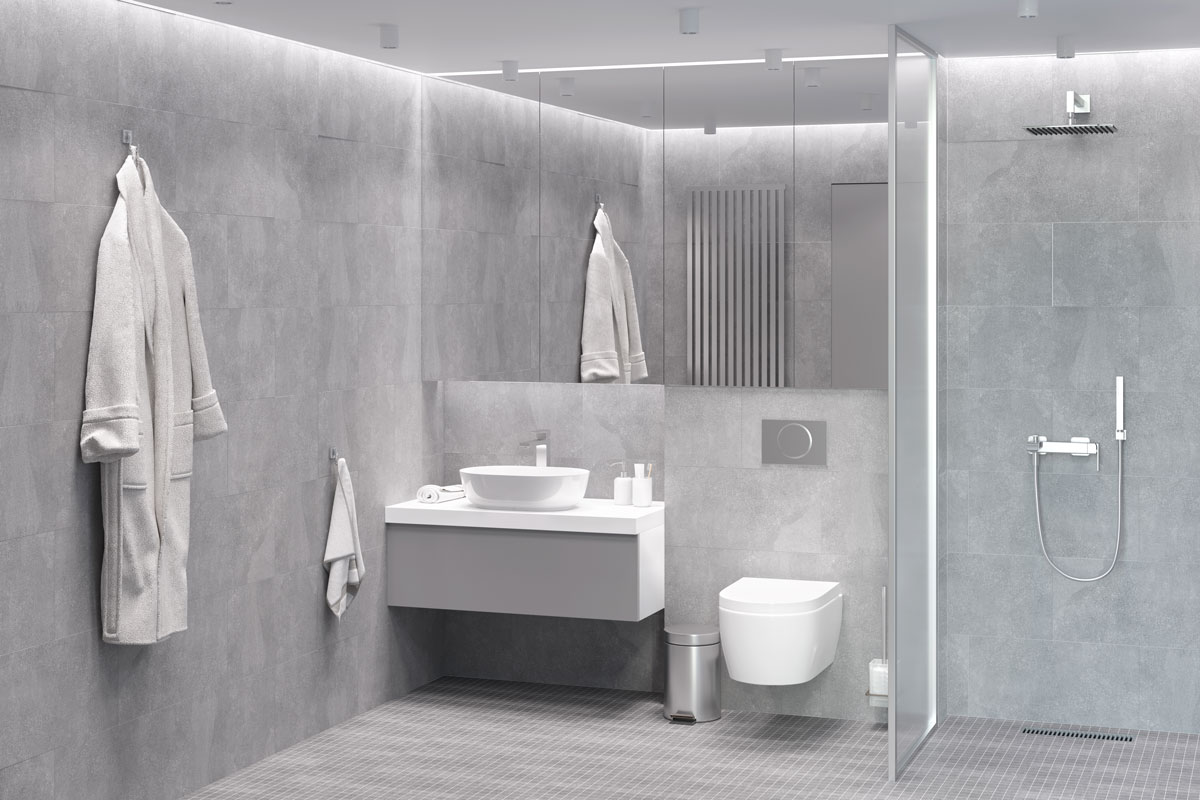 Interior of a gorgeous gray designed bathroom with a glass wall shower area and light gray ceiling