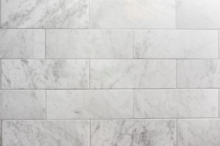 White marble tiles and matching gray grout, Grout Looks Wet Long After Shower - Is This Okay?