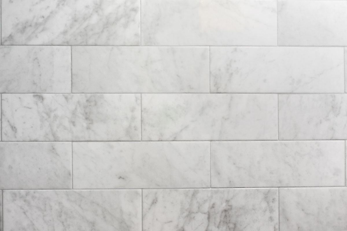 White marble tiles and matching gray grout