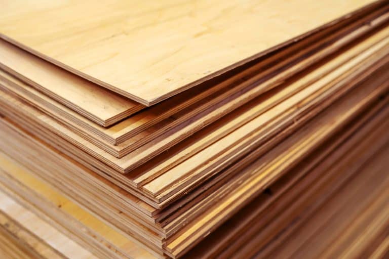 A lot of plywood sheets are stacked. Trade in wood building materials. Close-up, Does Plywood Need To Acclimate? [And For How Long?]