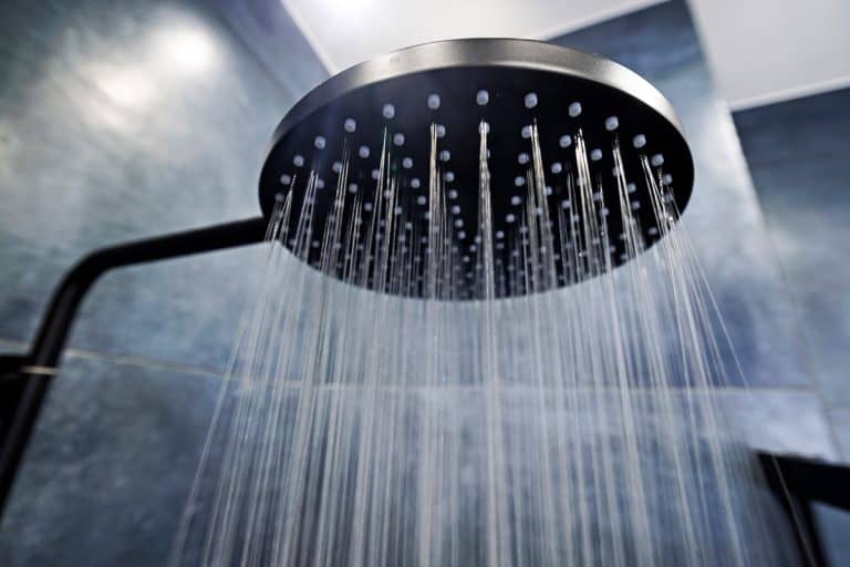 A rain shower head inside a modern house, Rain Shower Head Drips After Shut Off - What To Do?