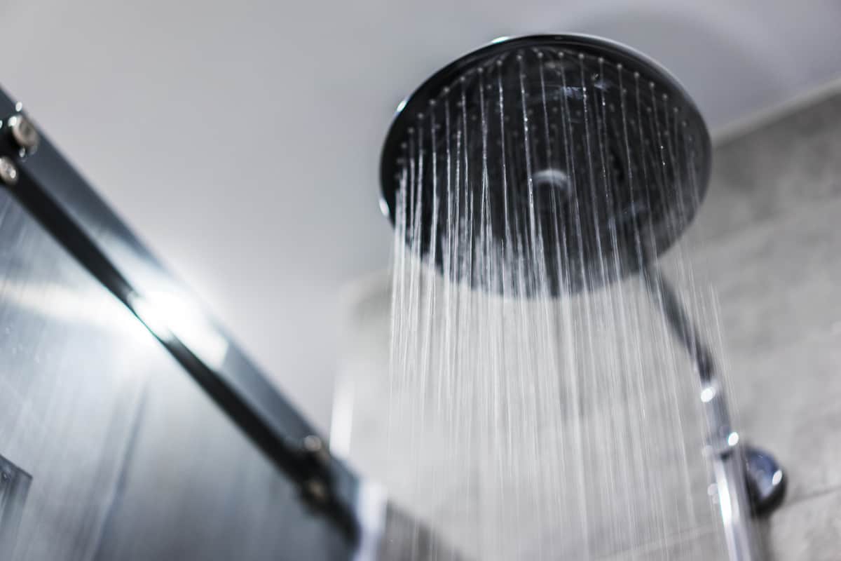 A rain shower head turn on in the living room