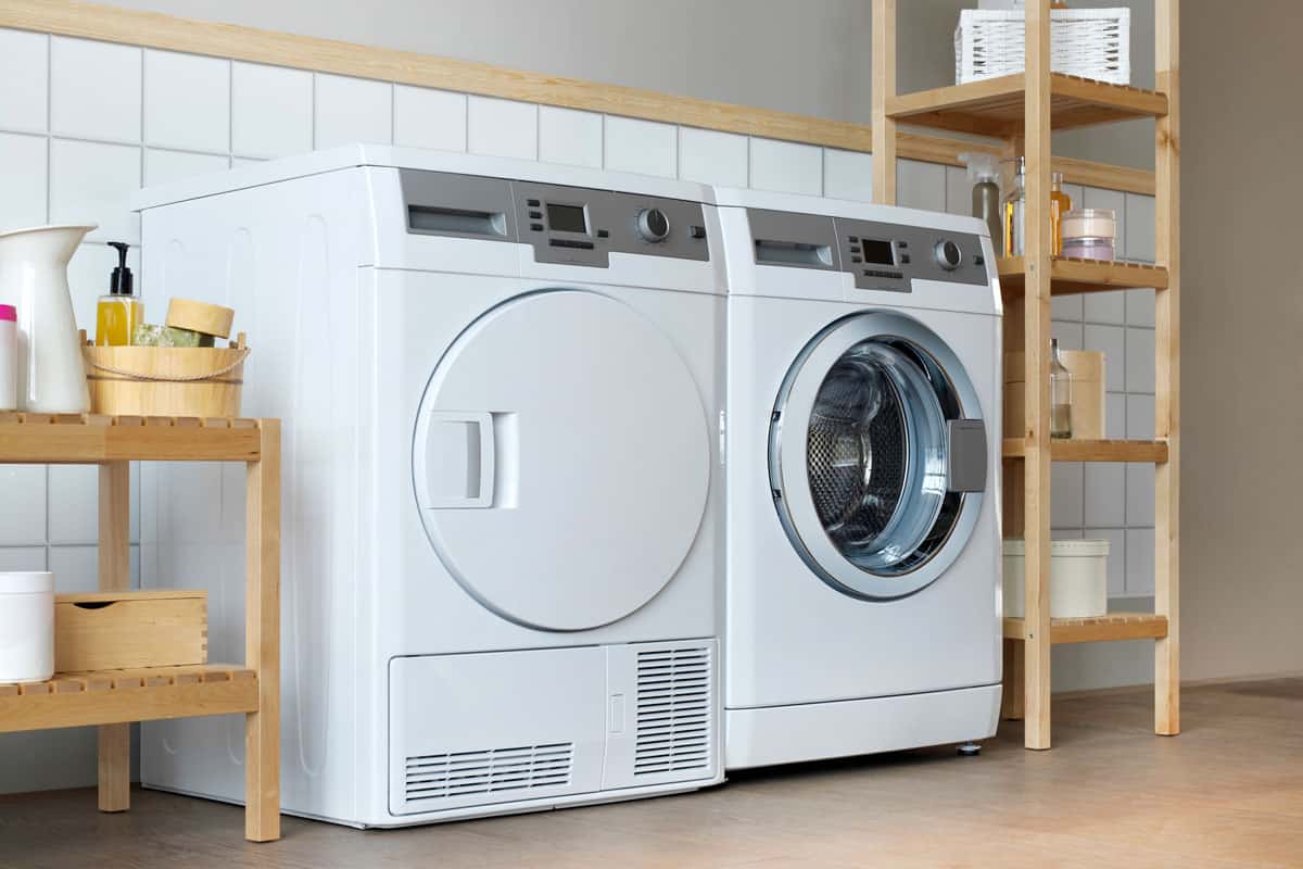 A washing machine home appliance with dryer beside it