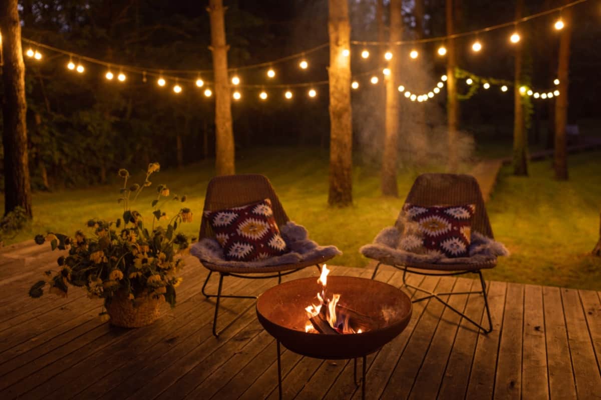 Create A Fire Barrier - Comfortable arranged porch with fire pit and chairs.