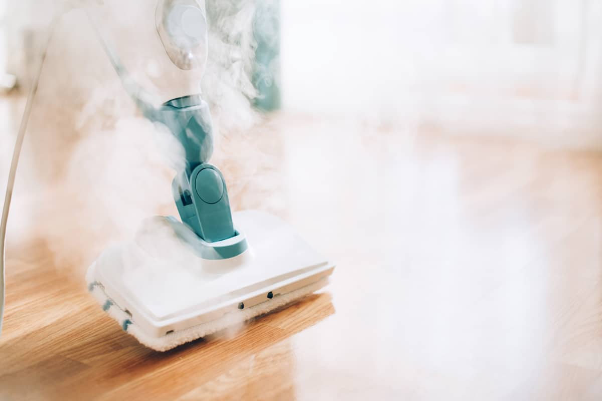 Steam cleaning the hardwood flooring