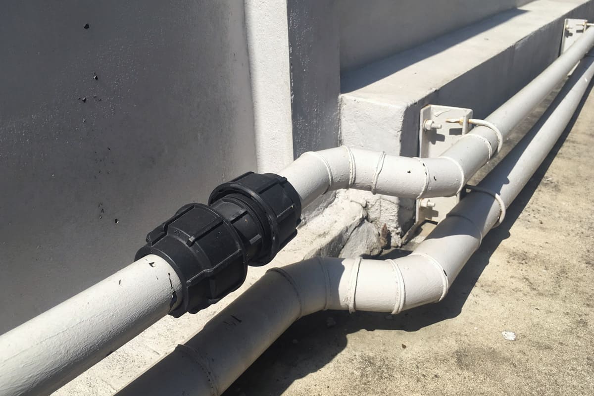 White Pipeline with Black PVC Tube Union Joint