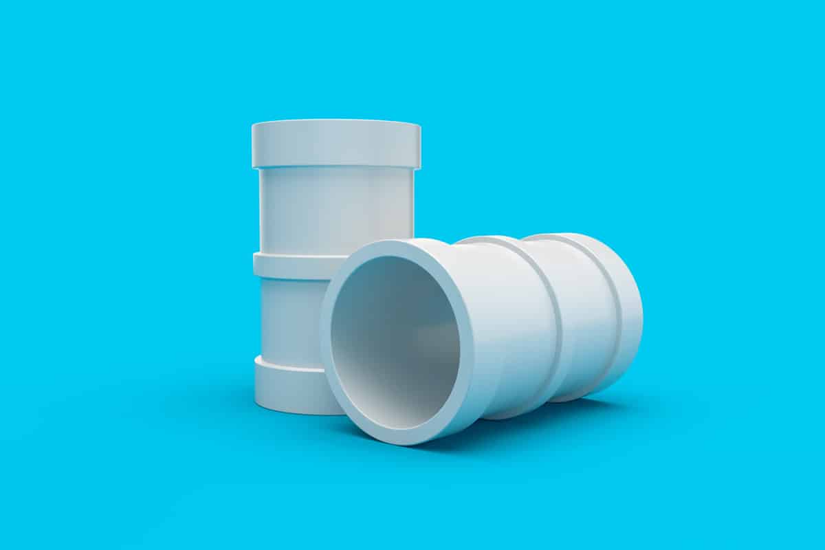 White plastic sewer pipes, isolated on a blue background pvc pipe fitting pipe socket joint