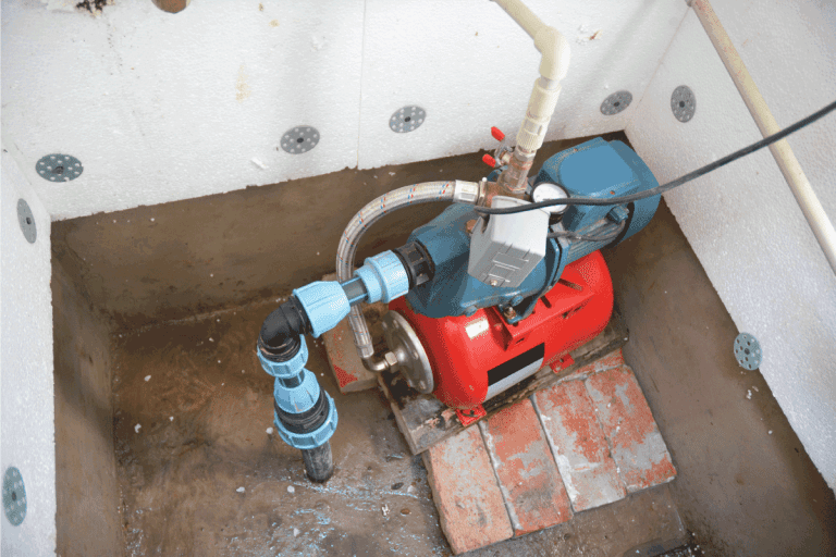 red electric water pump on a borehole complete with electrical connections. How Long Can A Well Pump Run Continuously