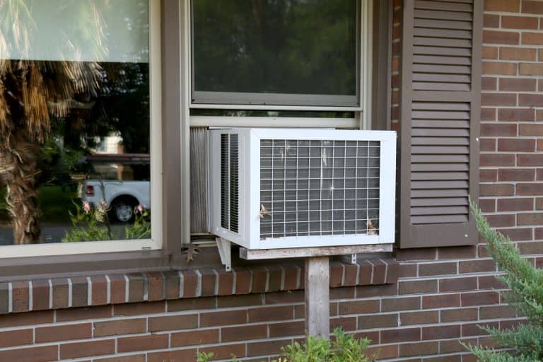 A old window unit air conditioner still being used by people whom don't have central air, How To Fill Gap Above A Window Air Conditioner?