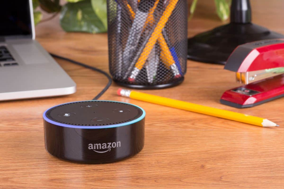 PETERSBURG, ILLINOIS-April 28, 2018: Amazon echo dot, a hands free voice controlled device that connects to the Alexa voice service on a wooden desktop