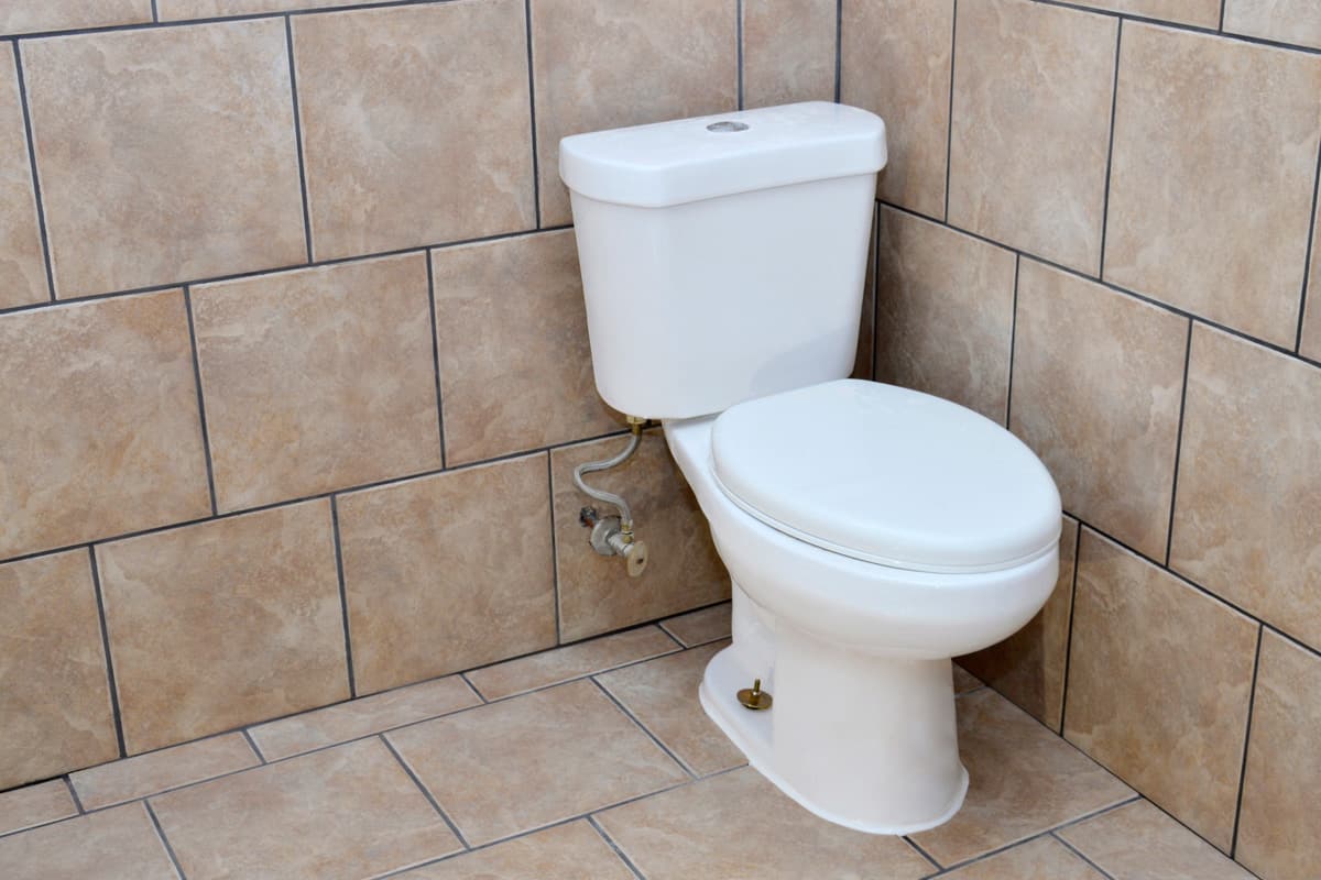 A new toilet installation done during a bathroom renovation.