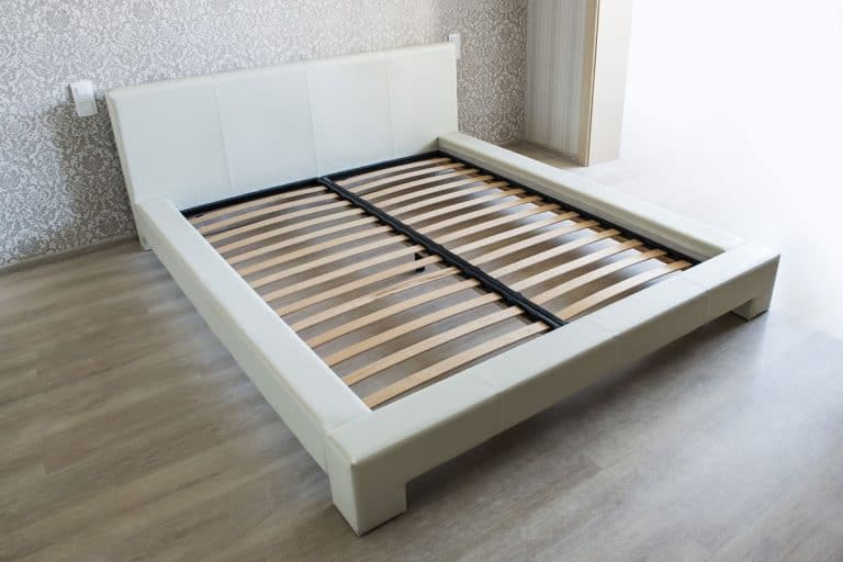 Bed in bedroom with wooden slats without mattress, How To Make A Center Support For A Bed Frame?
