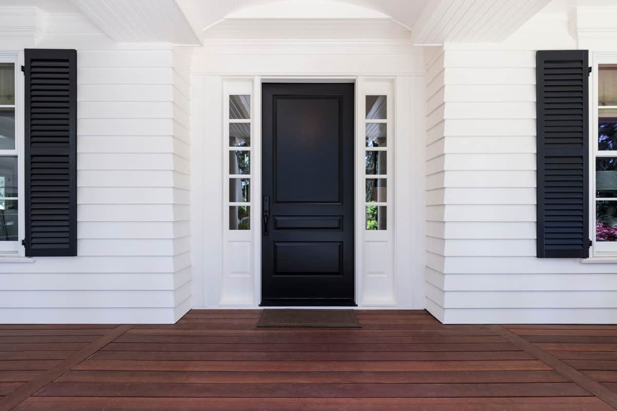 Black front door of classic style home in Oregon
