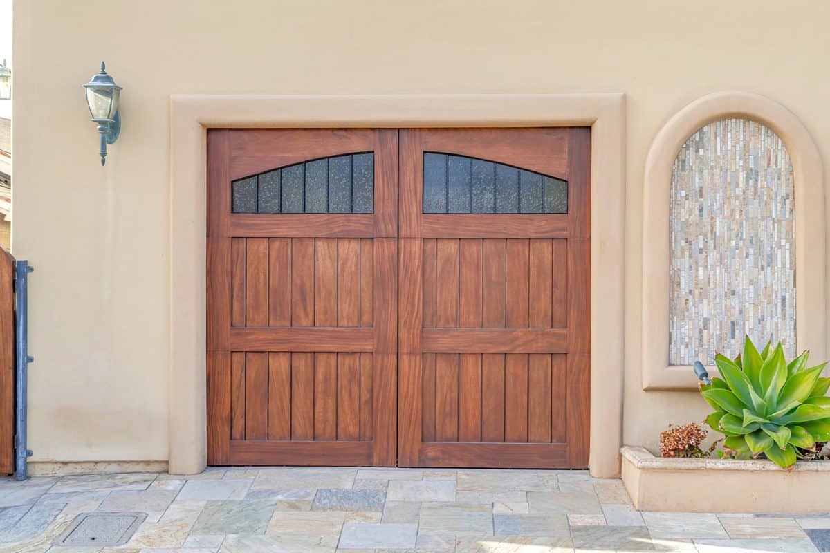 Brown wooden garage door with glass panes