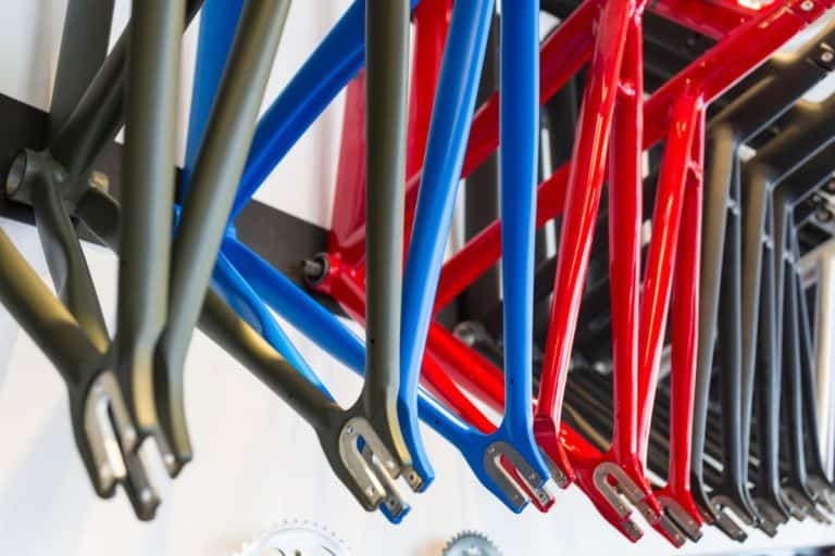 Hanging bicycle frames in a Japanese bicycle shop. - What Type Of Paint To Use On Bike Frame [Inc. Spray Paint Options]