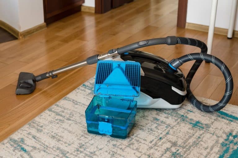 Washing vacuum cleaner. Carpet cleaning with a vacuum cleaner. Vacuum cleaner tank with dirty water after cleaning. Cleaning concept. - Bissell Carpet Cleaner Leaving Dirty Water - Why And What To Do?