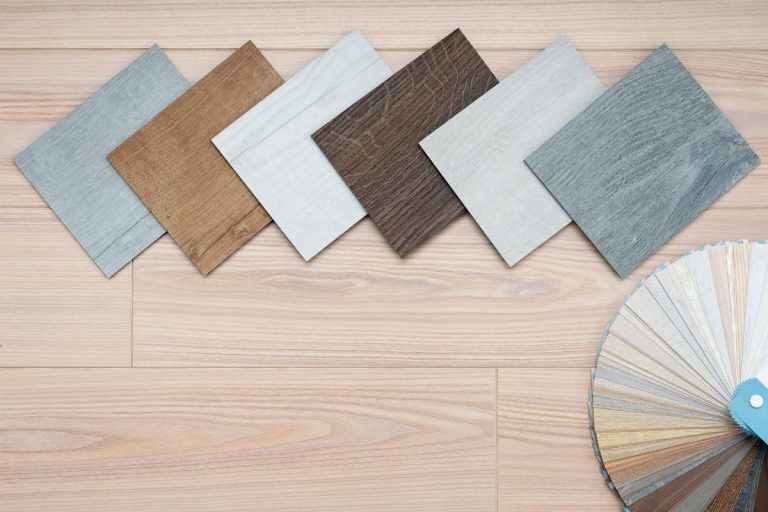 An example of a catalog of luxury vinyl laminate floor tiles and a designer palette with textures with a new interior design for a house or floor on a light wooden background, How To Match My Vinyl Flooring