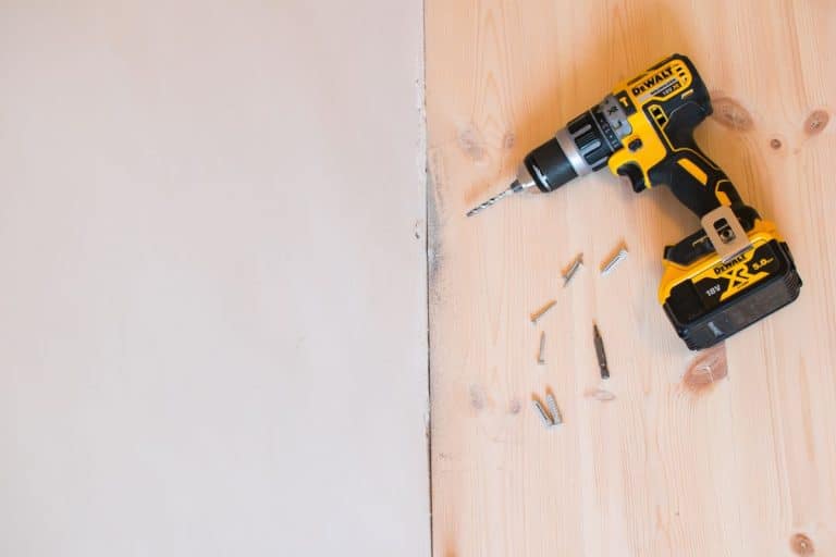 Drilling a hole in a concrete wall using a cordless Dewalt drill, How To Use A DeWalt Drill [Step-By-Step Guide]