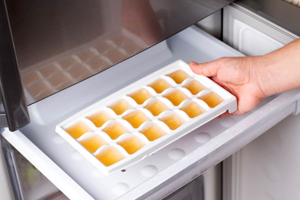 Frozen Lemon Juice cubes in tray in the freezer