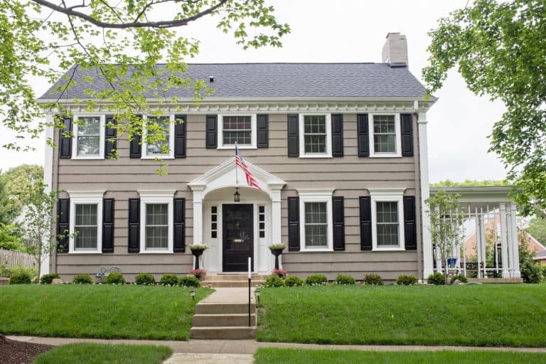 Gray Georgian colonial home, Should Your Front Door Match Your Shutters?