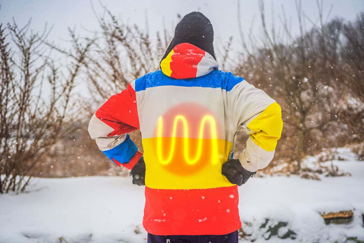 A man in a heated winter jacket. Under the jacket heating elements