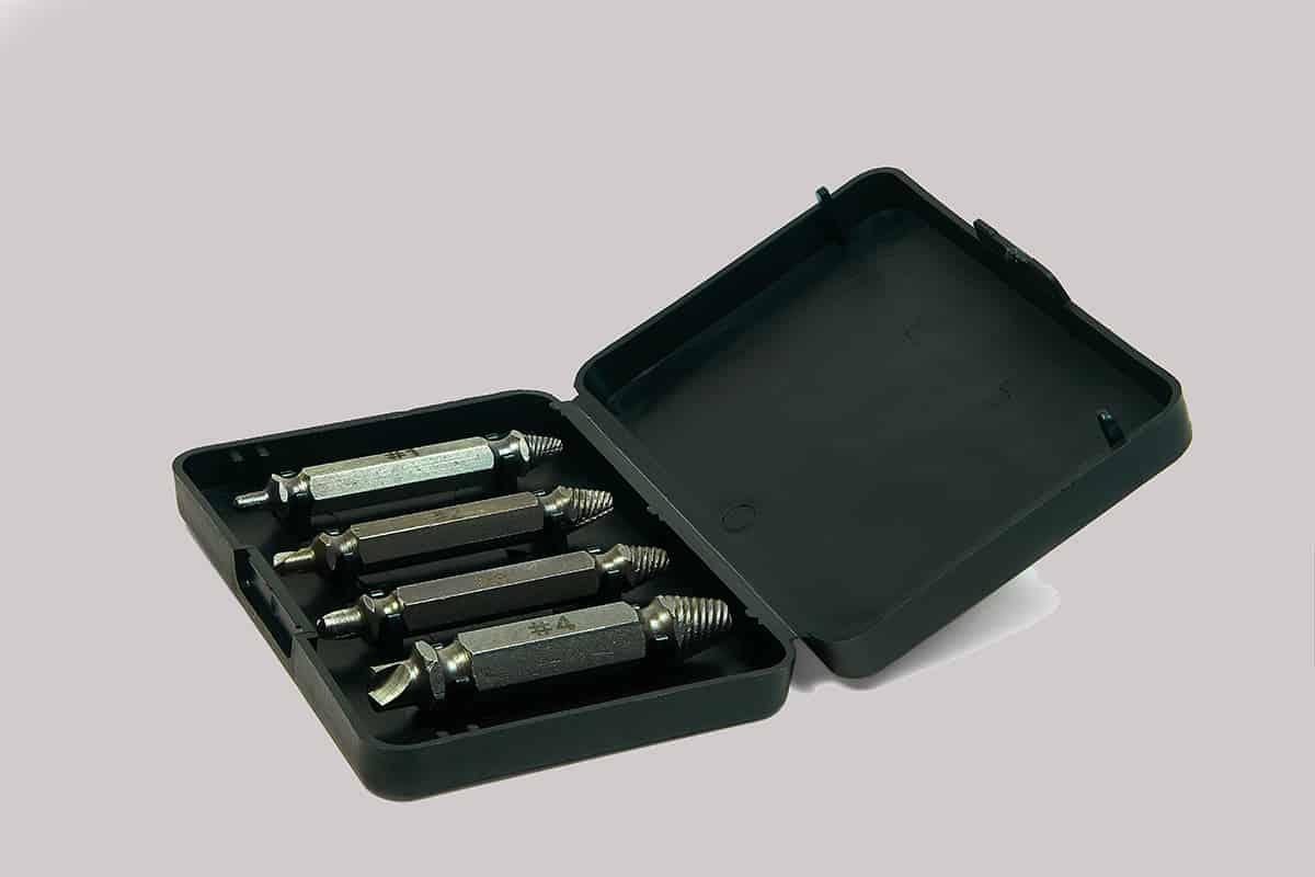 Set of screw extractors in a black plastic box
