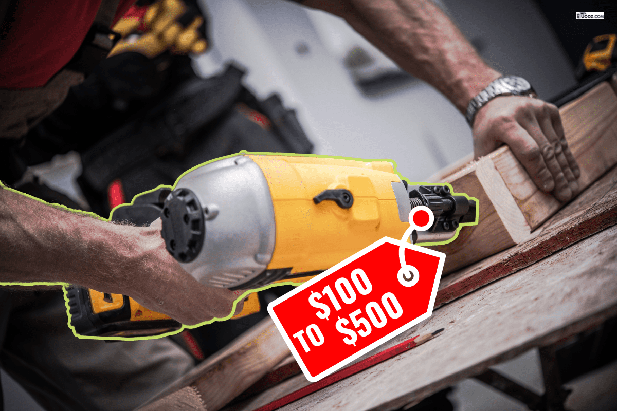 Woodwork Using Nail Gun. Caucasian Construction Worker Creating Wood Elements Using Powerful Nail Gun Tool. - How To Load A Dewalt Nail Gun [Quickly & Easily]