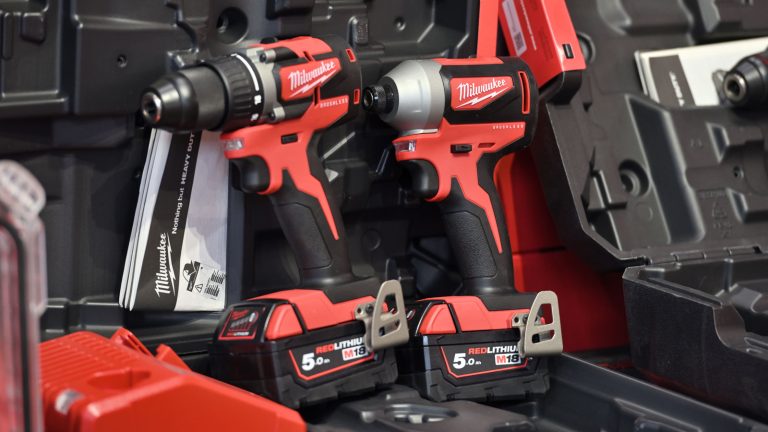 A Milkwaukee drill and impact wrench, How To Easily Remove A Milwaukee Battery M18 - 1600x900