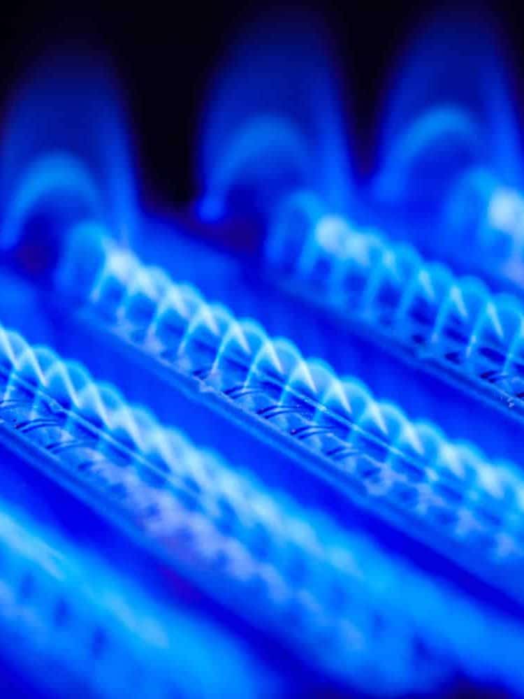Propane flame inside of gas boiler furnace

